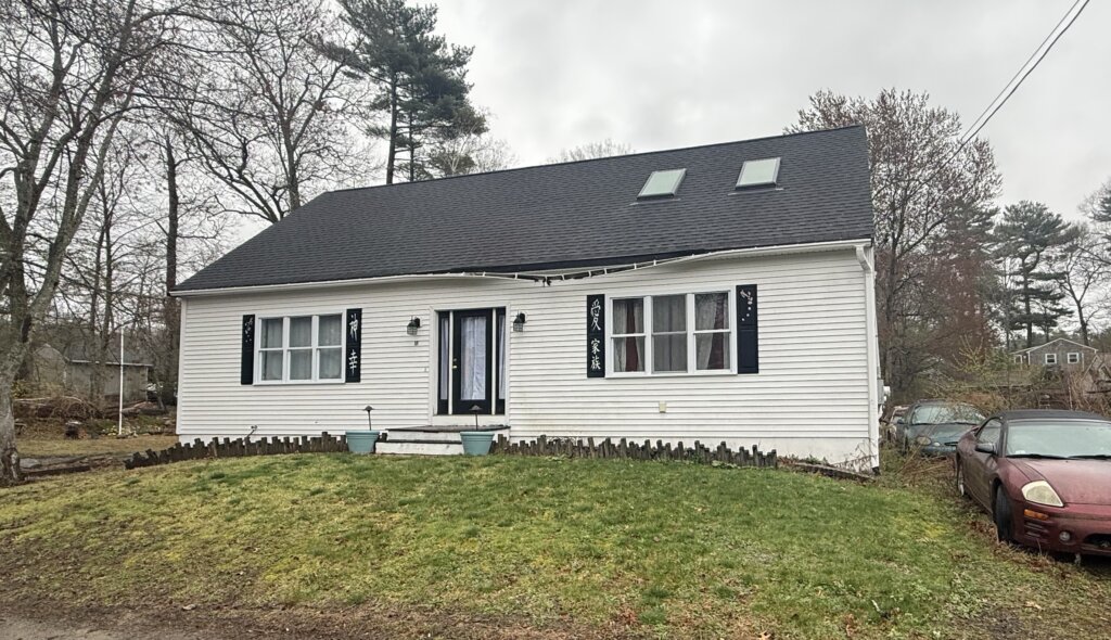 White ranch style home with ripped off gutter in Halifax MA – we buy houses Halifax Massachusetts