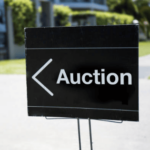 the pros and cons of selling land at auction