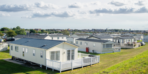 Rows of mobile homes in a park setting, illustrating mobile home cost and community living.