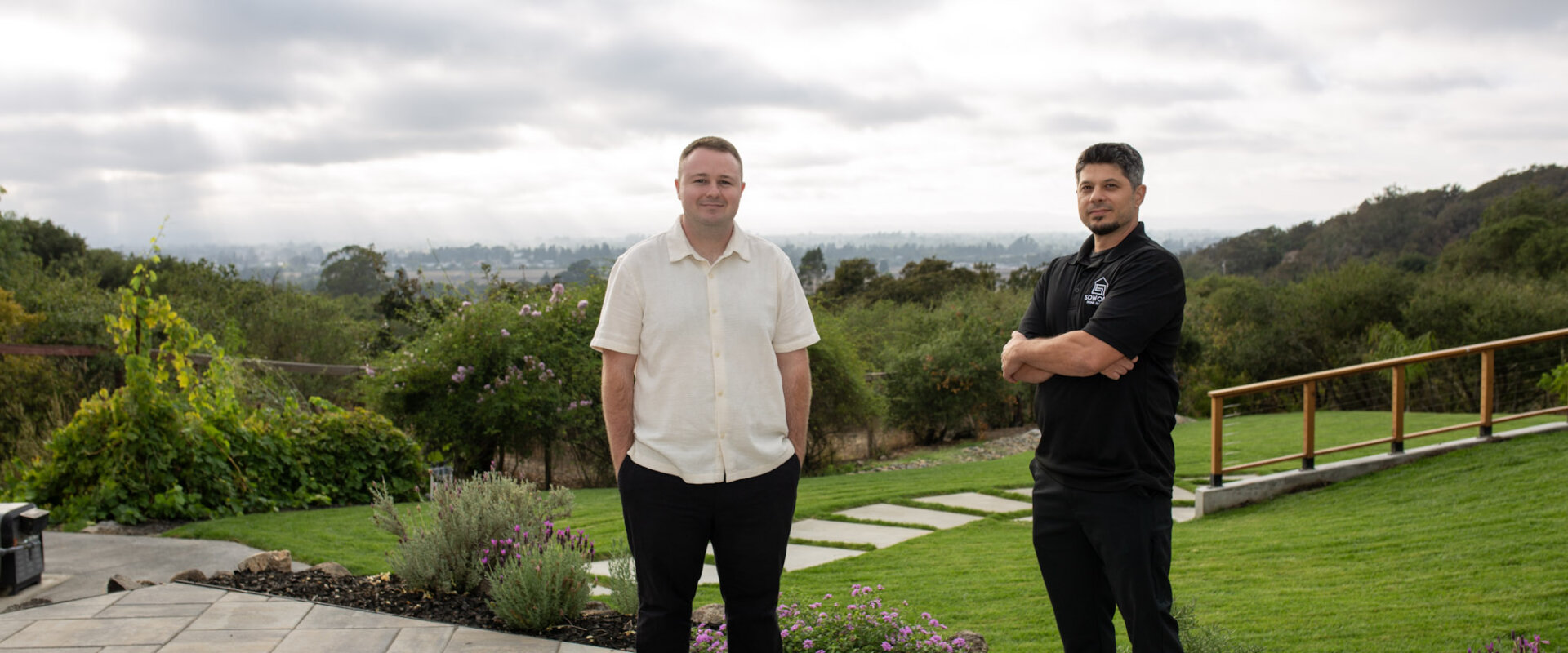 Wyatt and Brian from Sonoma Home Buyers standing on a patio with Sonoma County hills in the background.