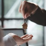 keys being handed over about understanding benefits of home buying company