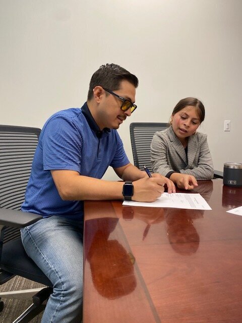 Cash home buyers signing documents to buy a house fast in Texas
