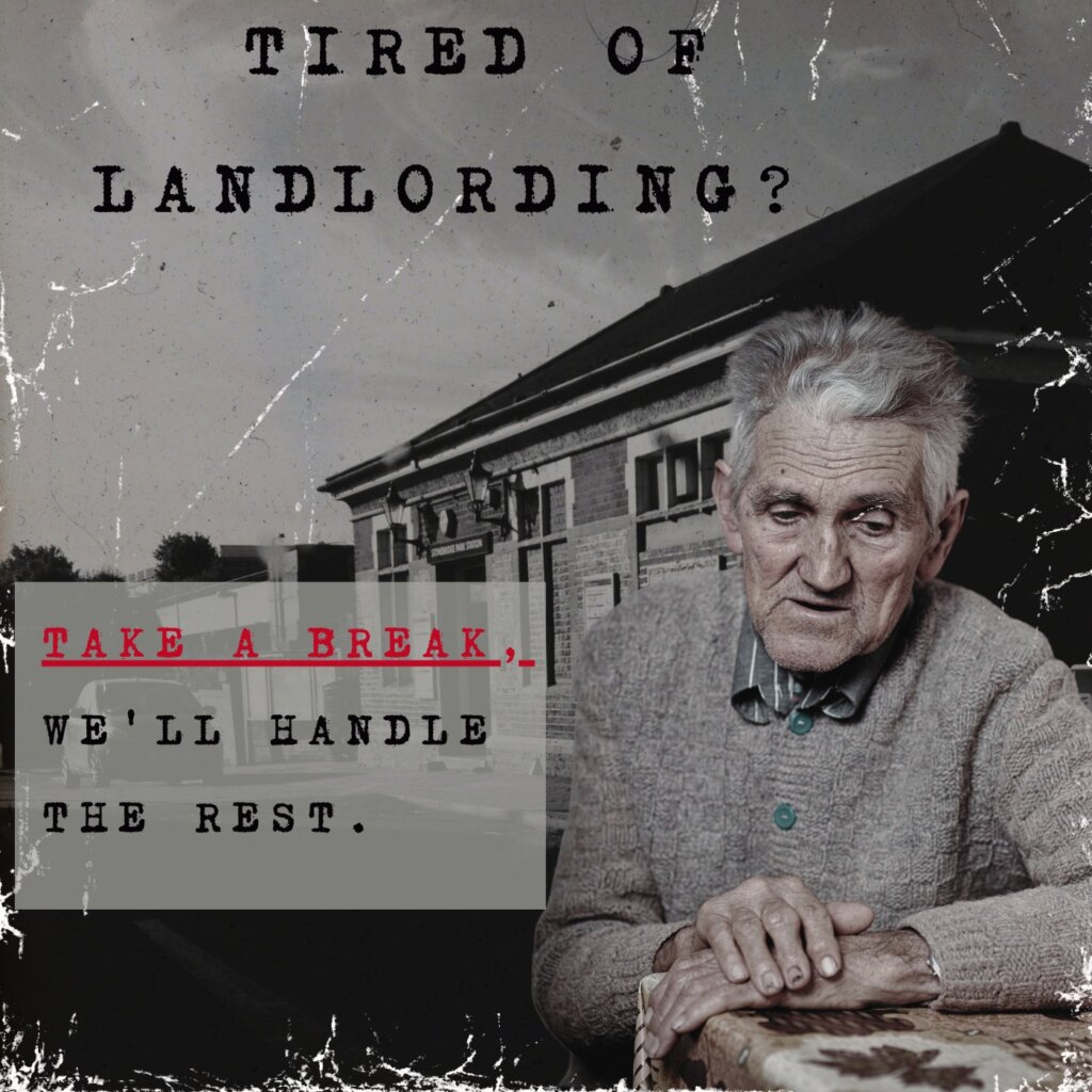 "Overwhelmed landlord holding head in hands while sitting at a desk covered in paperwork, highlighting the stress of property management.