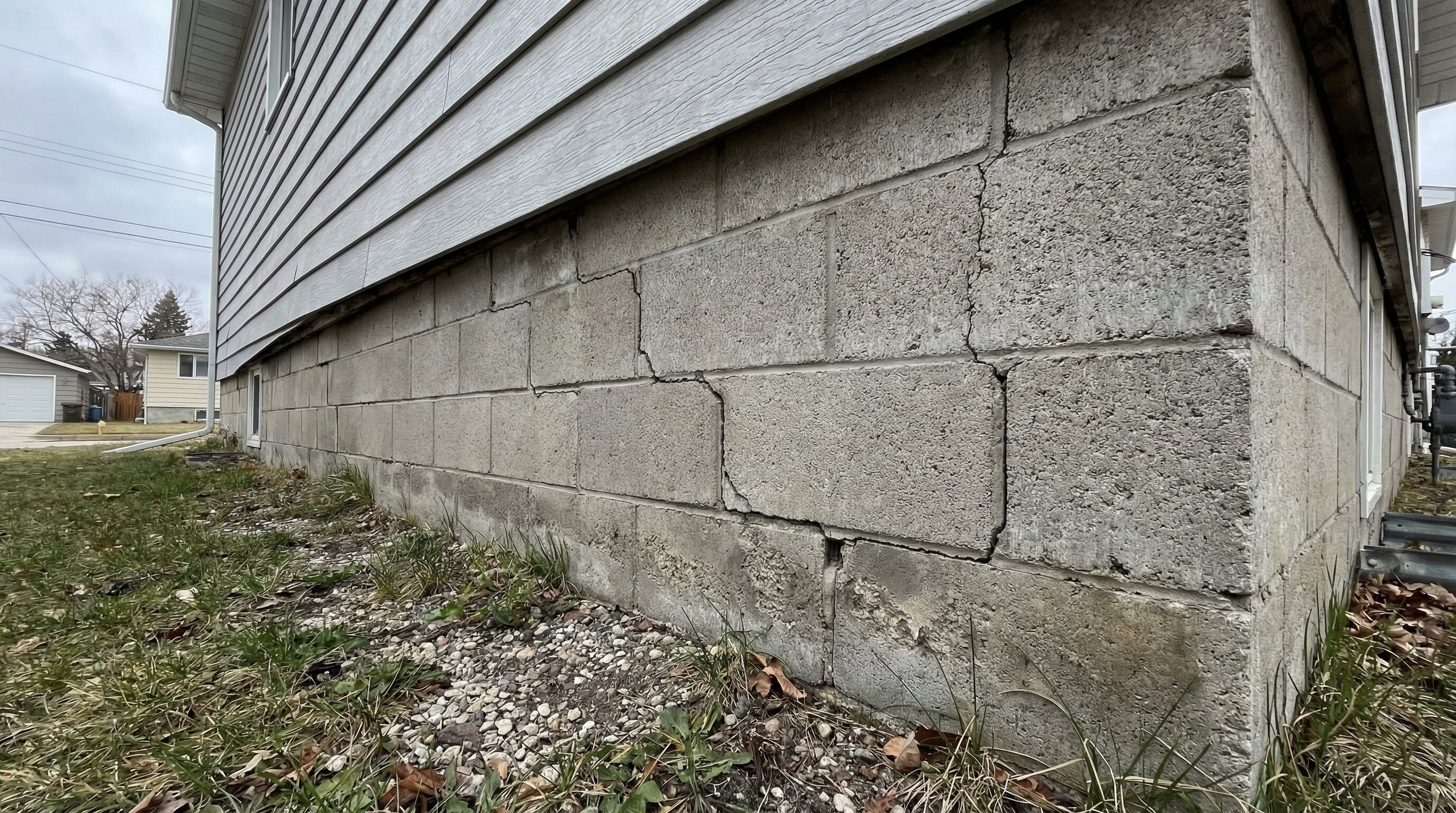 Winnipeg house showing foundation cracks along the base