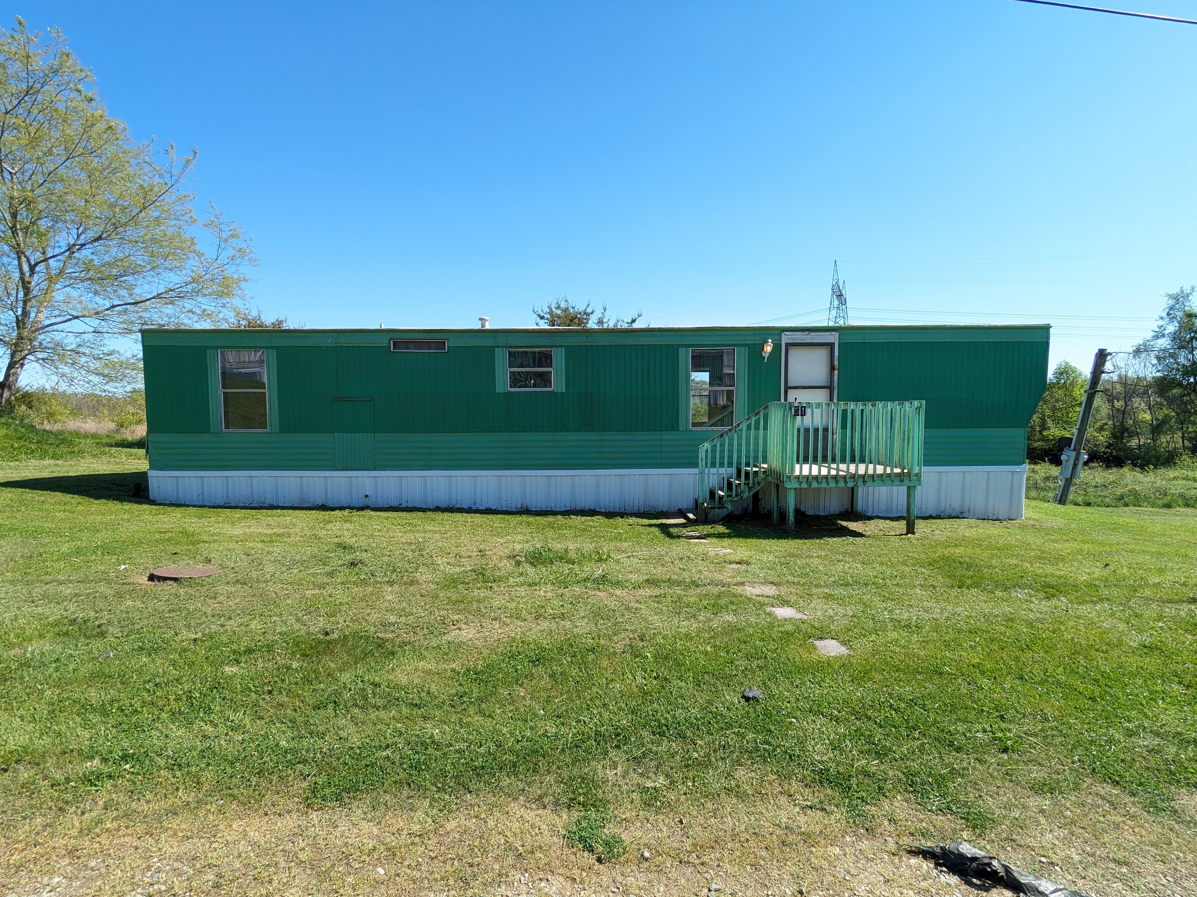 Aging single-wide mobile home on land in Hamblen County TN