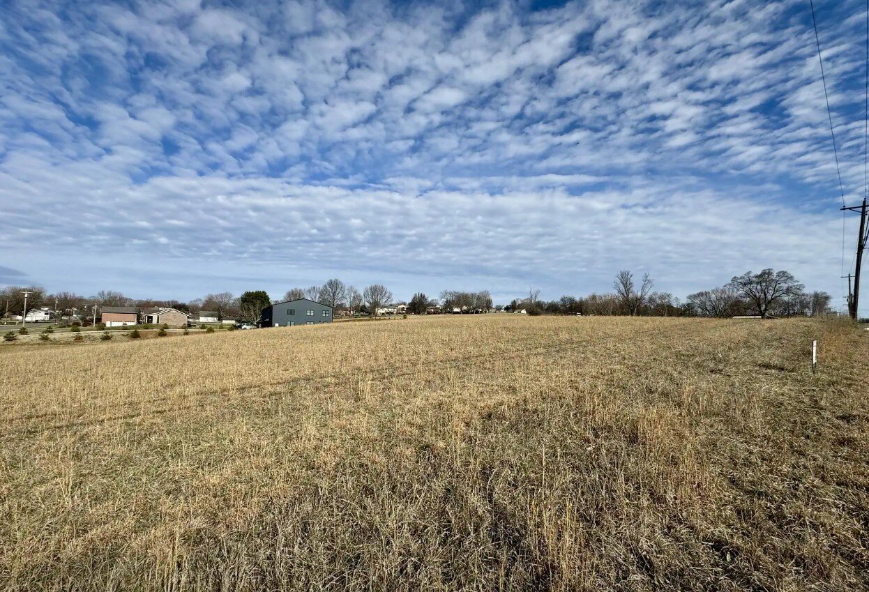 Aerial photo of Hamblen County TN land with a For Sale sign
