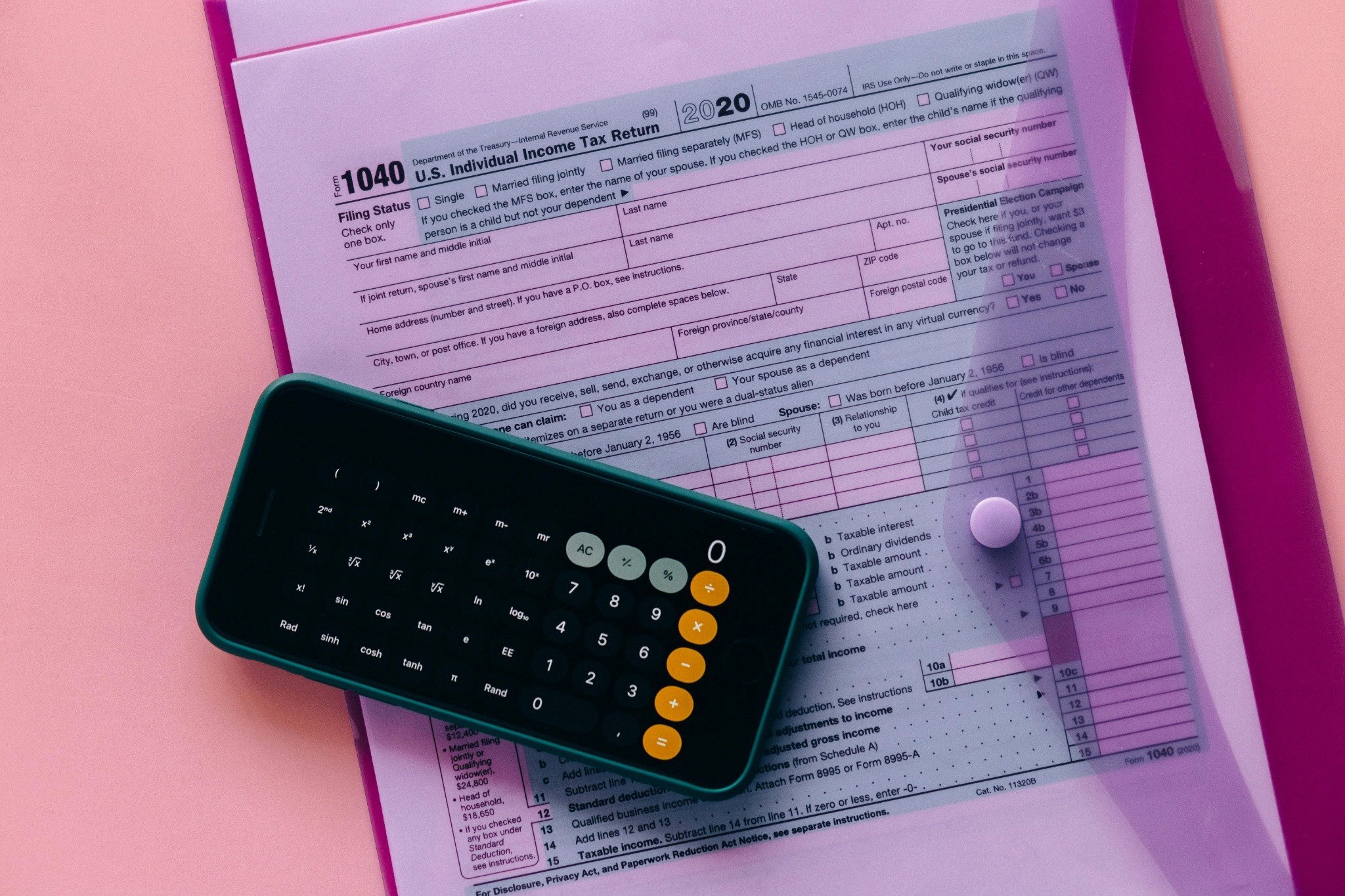 Land sale paperwork, calculator, and property tax bill in Knox County TN