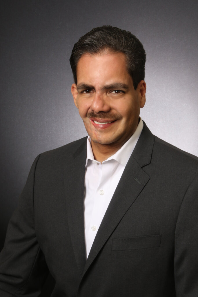 Local real estate investor and owner of A+ Home Buyers, Erick Alin, smiling in his profile picture.