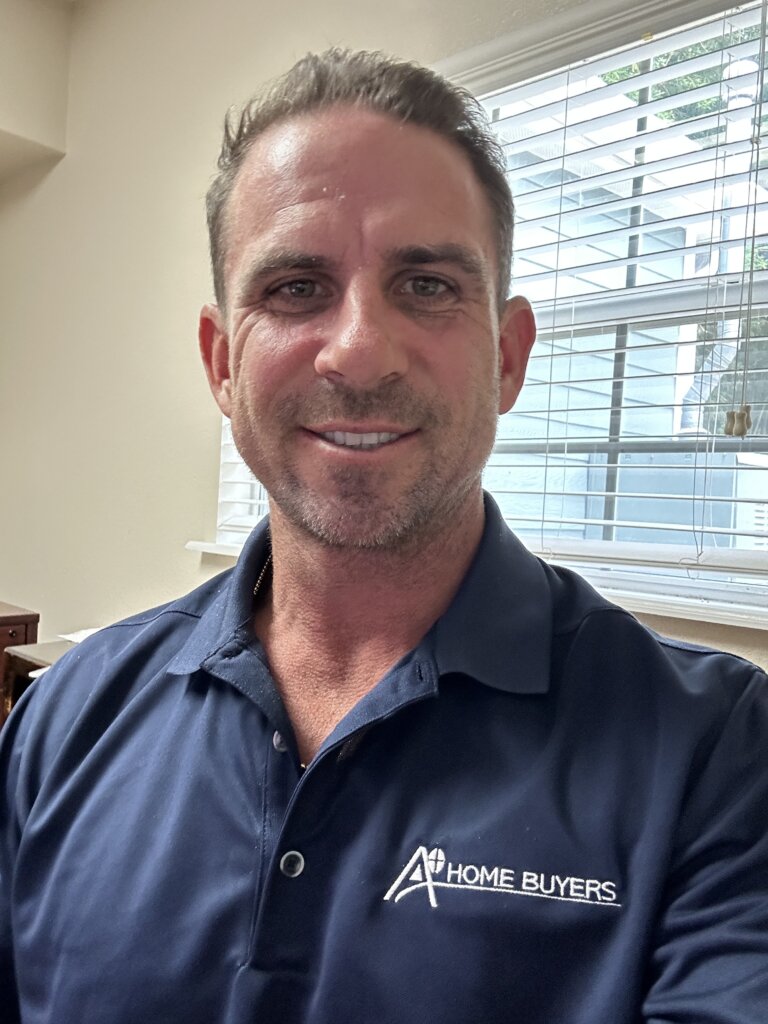 Local real estate investor and owner of A+ Home Buyers, Mike Youngblood, smiling in his profile picture.