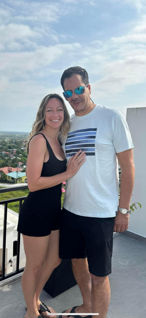 Owner of A+ Home Buyers, Erick Alin posing for a photo with his wife Carolyn.