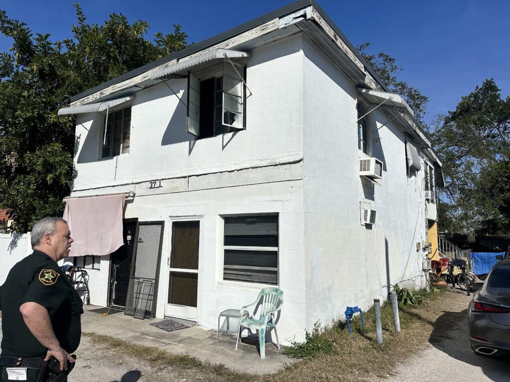 Saint Petersburg quadplex sold with liens paid at closing exterior of front yard