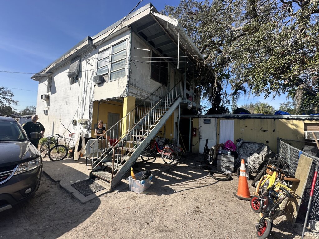 Saint Petersburg quadplex sold with liens paid at closing exterior of side yard