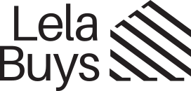 Simple line drawing of a house in black with the text "Lela Buys" underneath