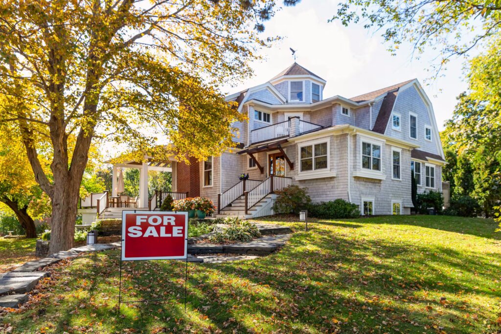 As-is home in Lancaster, NY showing visible exterior repairs before sale