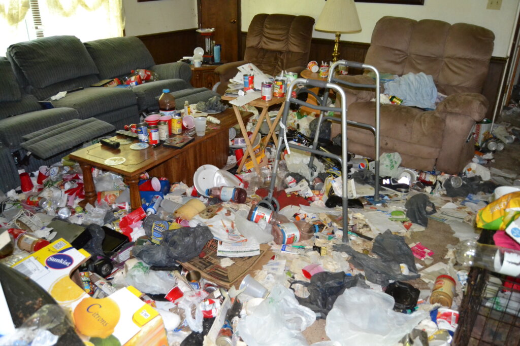 Cluttered Buffalo home interior illustrating how to sell a hoarder house in Buffalo, NY