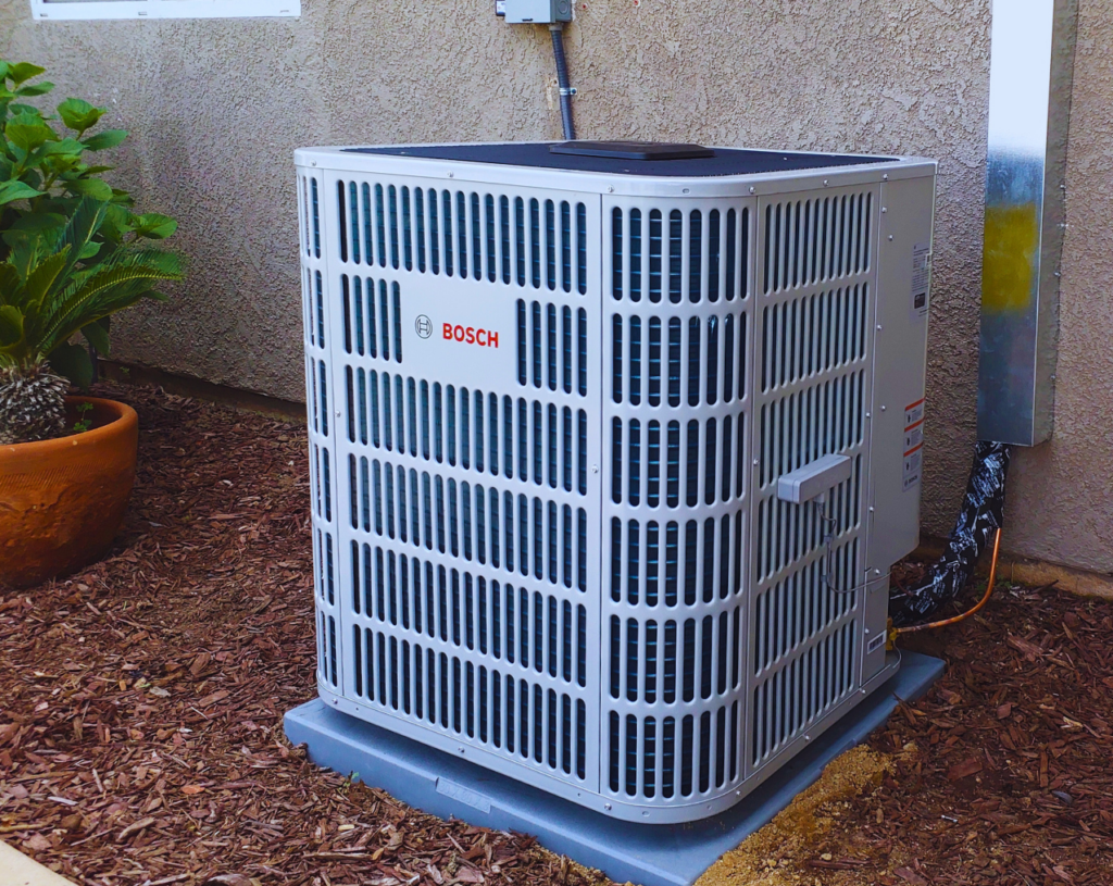 Bosch heat pump installed outdoors, providing energy-efficient heating and cooling.