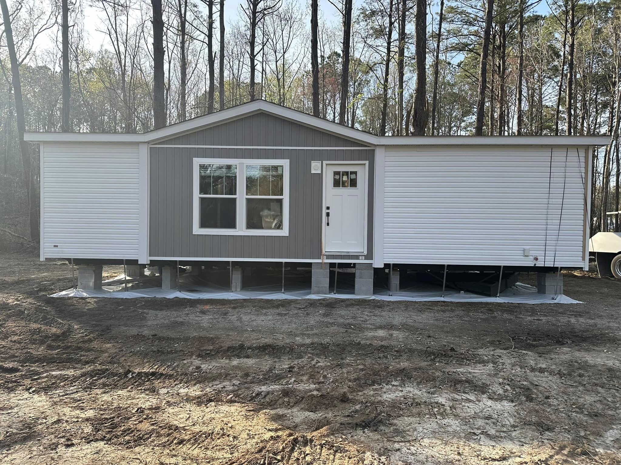 Mobile Home Moving Service Ties Down Mobile Home.