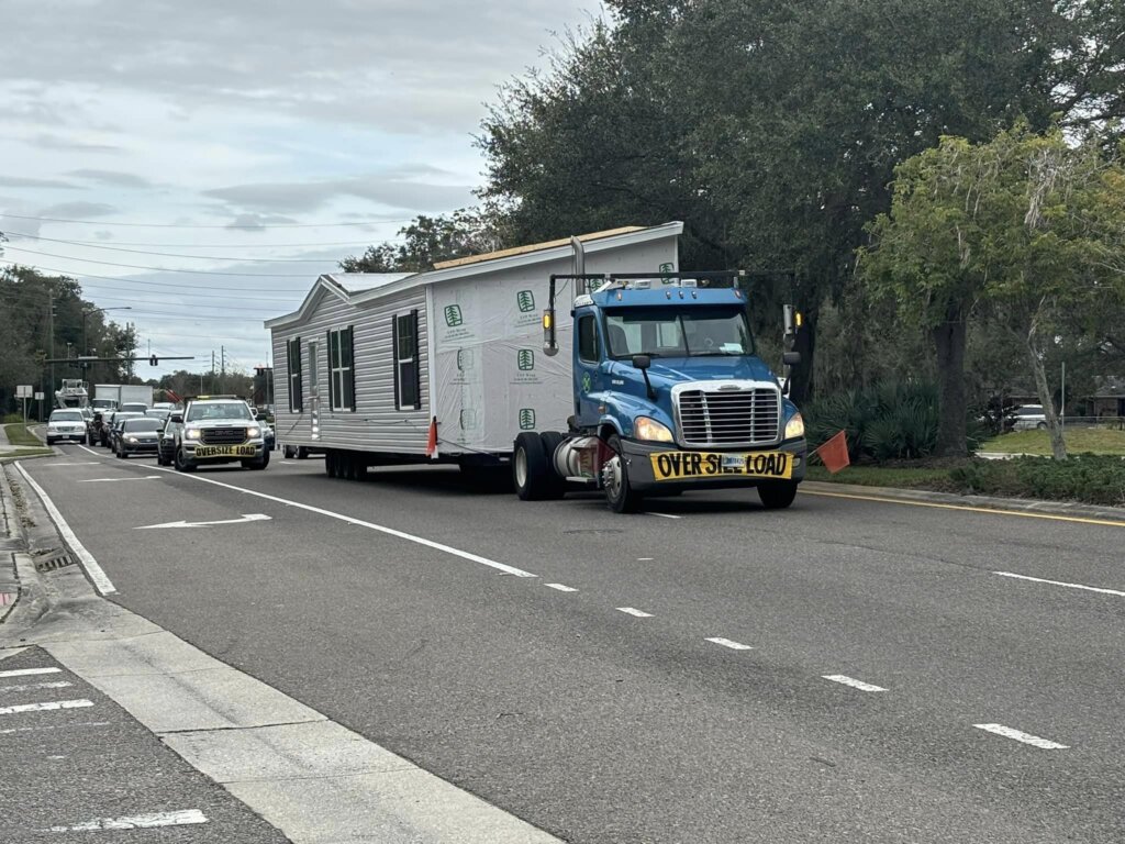Truck hauling trailer - double wide trailer and singlewide mobile home