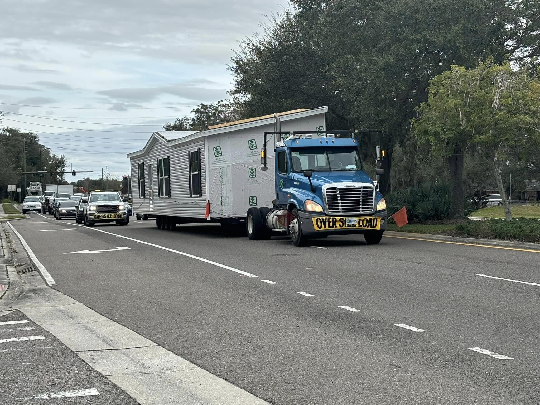 Truck hauling trailer - double wide trailer and singlewide mobile home