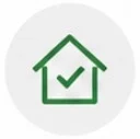 Green house icon with a checkmark inside a circular background.