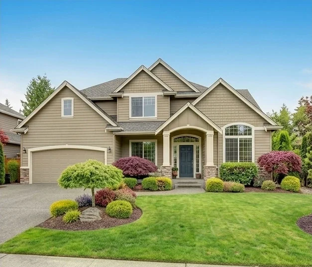 Beautiful suburban home with landscaped yard and stone accents
