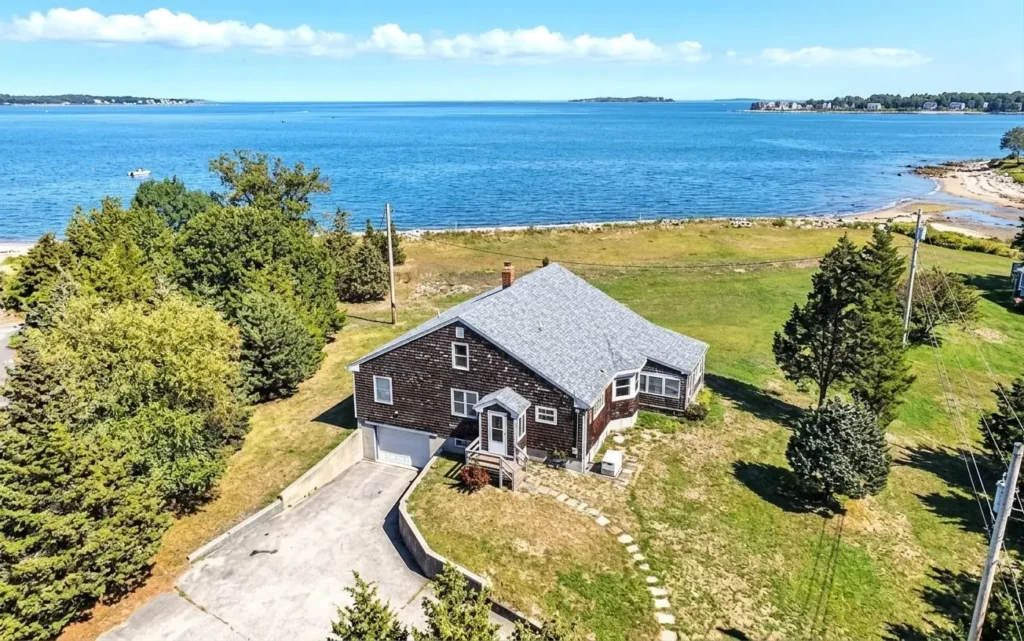 Aerial view of a coastal property that would be perfect for someone considering selling a vacation cottage in Plymouth MA.