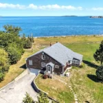 Aerial view of a coastal property that would be perfect for someone considering selling a vacation cottage in Plymouth MA.