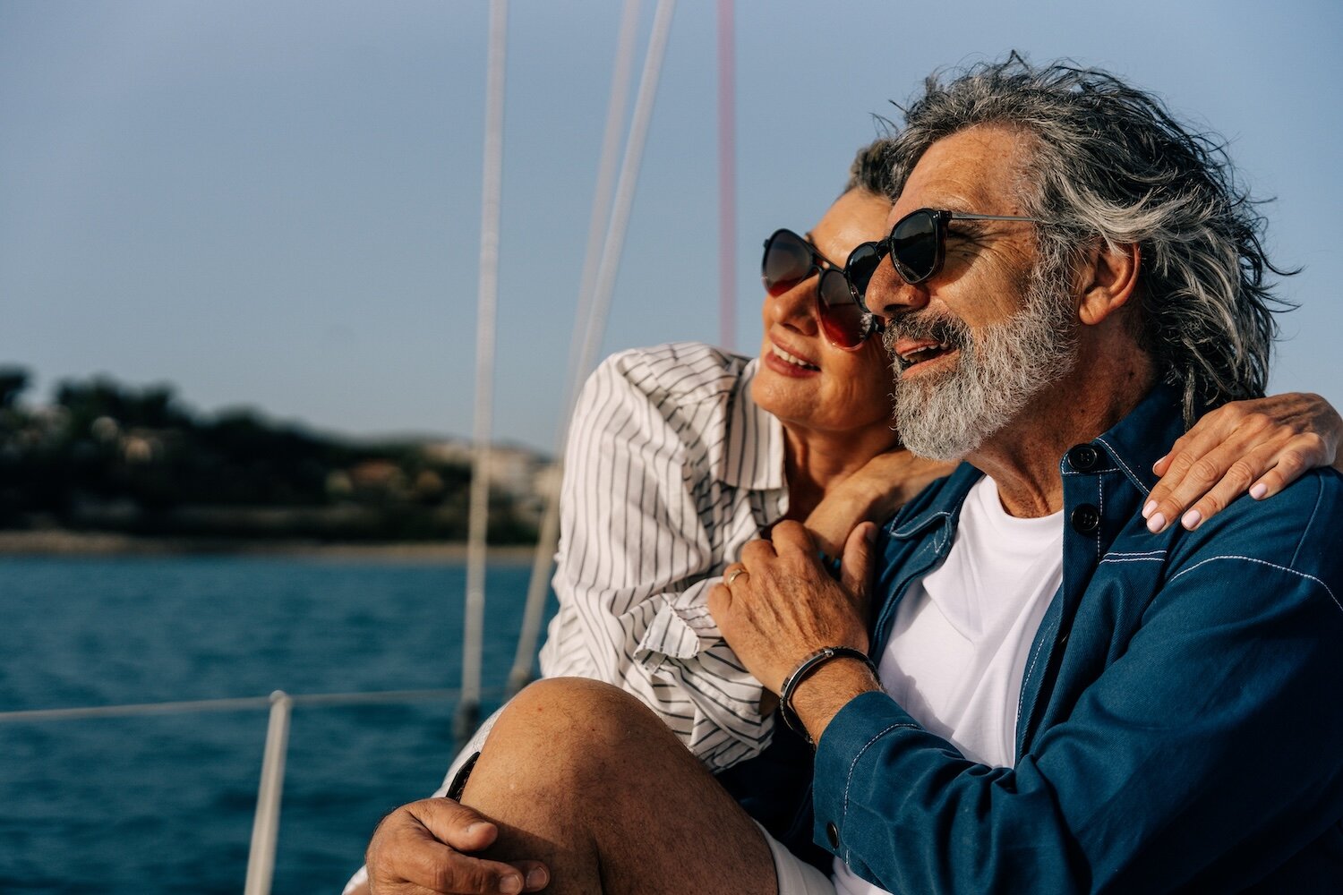 Senior couple enjoying sailing, luxury life, active retirement RealPro Homebuyers Website Longmont Colorado Page