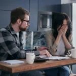 Homeowner reviewing tax forms after selling an inherited house in South Carolina – capital gains and tax consequences explained.