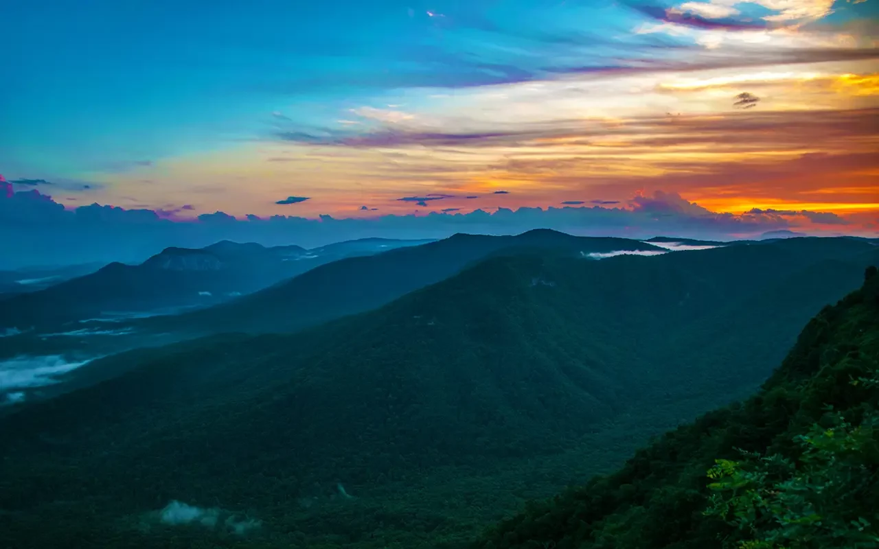 Panoramic view of the South Carolina mountains with sunrise light — representing Table Rock Homebuyers, a trusted local company that buys houses and mobile homes for cash anywhere in Upstate and Midlands South Carolina.