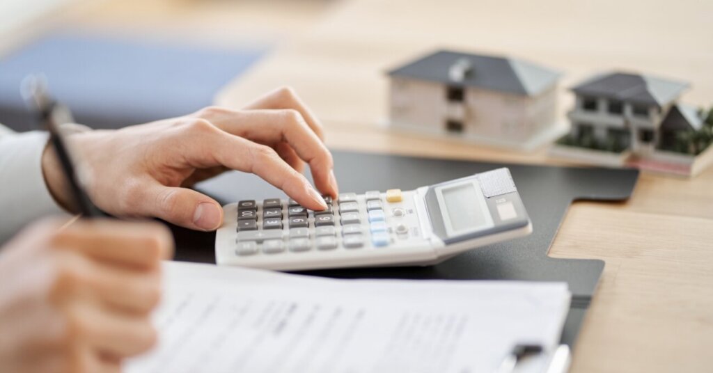 Buyer and seller reviewing mortgage options for a distressed house in Erie, PA