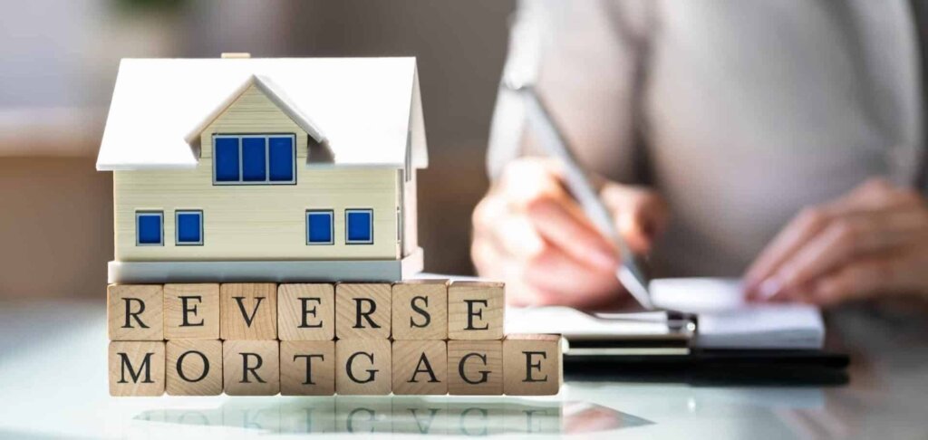 Homeowner reviewing reverse mortgage documents before selling a house.