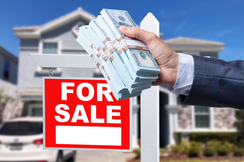 Homeowner reviewing a cash house offer and estimated net sale proceeds in Erie, PA.