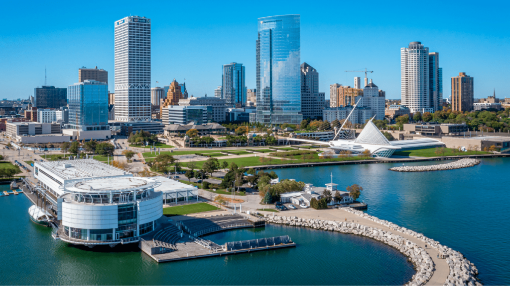 Aerial view of a city waterfront with modern skyscrapers and real estate opportunities.