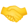 A handshake between two hands, symbolizing agreement, partnership, or a successful deal.