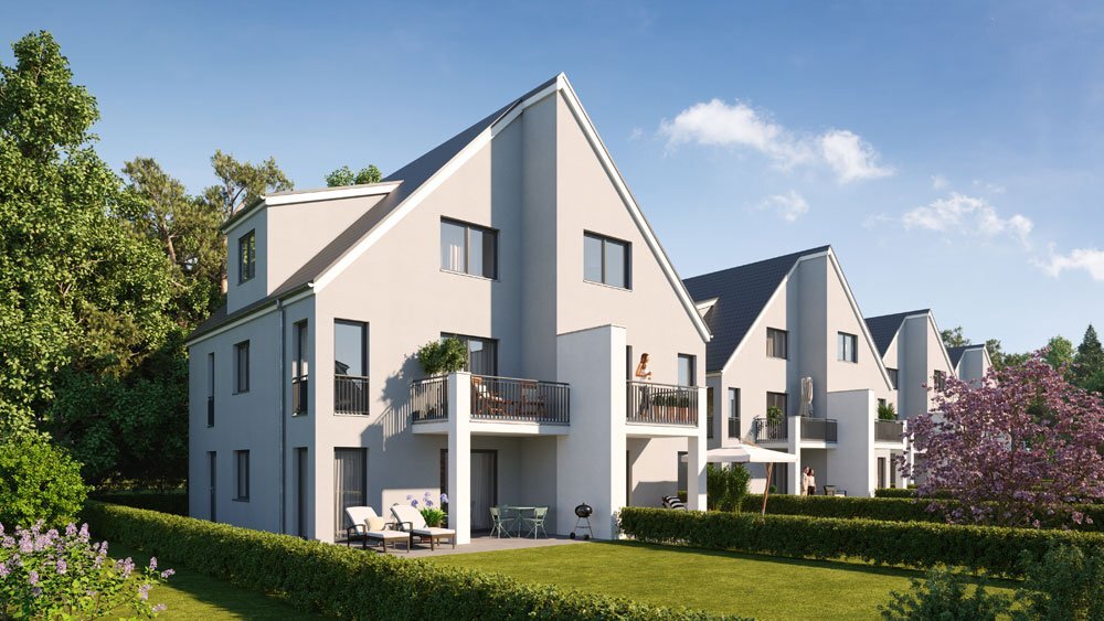 Contemporary gray townhouse complex with distinct slanted roofs and large windows. Each unit has a private balcony with outdoor seating, overlooking a lush green backyard, framed by trees and hedges. The design is minimalist, with clean lines and a focus on modern living.