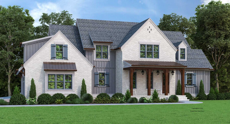 A spacious two-story house with a mix of brick and siding exterior. The home features multiple large windows, a gabled roof, and a welcoming front porch. It is surrounded by green landscaping and mature trees.