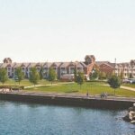 Waterfront apartments and green park space along the Kenosha harbor.