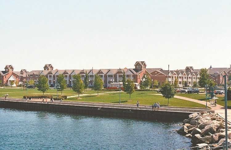 Waterfront apartments and green park space along the Kenosha harbor.
