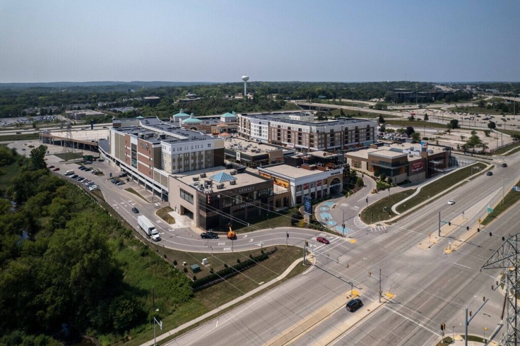 Aerial view of The Corners of Brookfield shopping and residential complex in Brookfield, Wisconsin, surrounded by major roads and greenery.