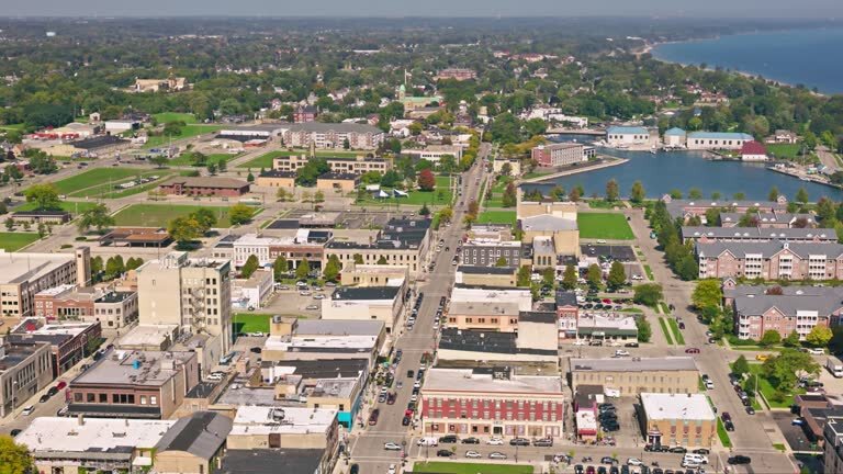 Aerial view of downtown Kenosha, Wisconsin, featuring commercial buildings, residential areas, and the Lake Michigan shoreline in the background.
