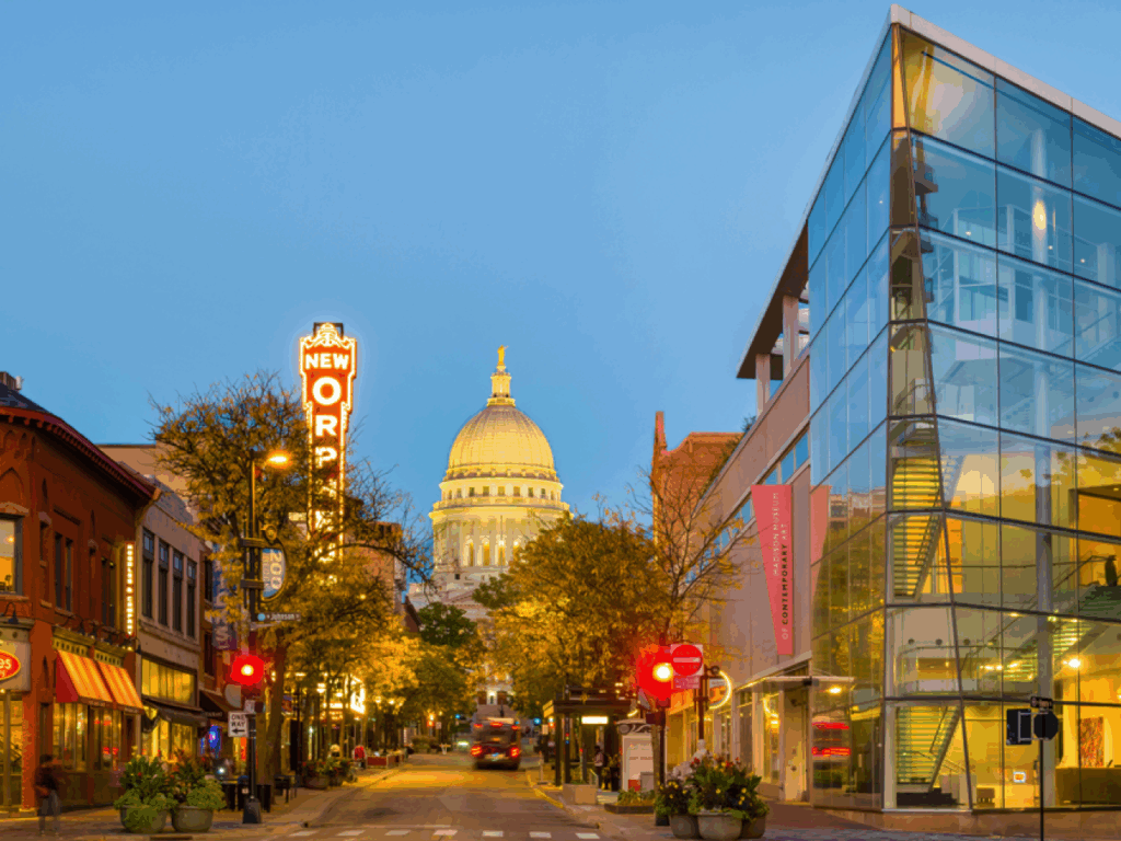 Downtown Madison with Capitol building and New Orpheum sign at dusk.