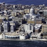 Aerial view of downtown Madison, Wisconsin, featuring the Wisconsin State Capitol near Lake Monona.