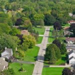 Aerial view of a suburban neighborhood in Brookfield with tree-lined streets and well-kept homes.