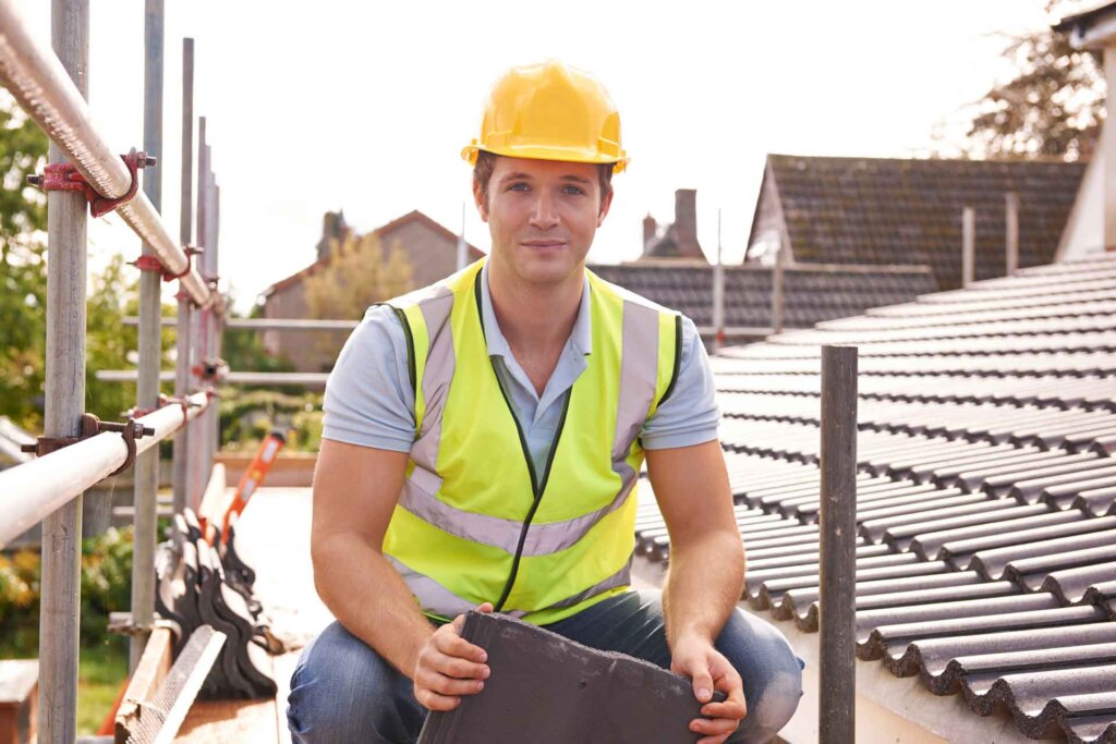 man on roof in hard hat