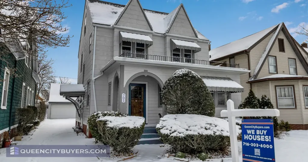 Buffalo house in winter with a Queen City Buyers We Buy Houses sign