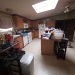 Cluttered kitchen in a house sold as-is for cash, the way owners sell their house as-is in Dayton