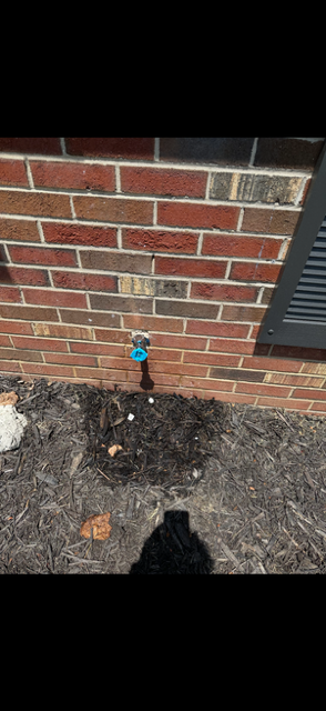 Exterior hose spigot and brickwork at 1922 Old Coach Road