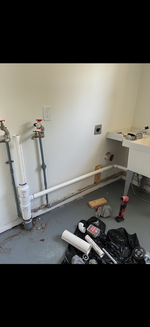 Laundry-area plumbing at 1922 Old Coach Road