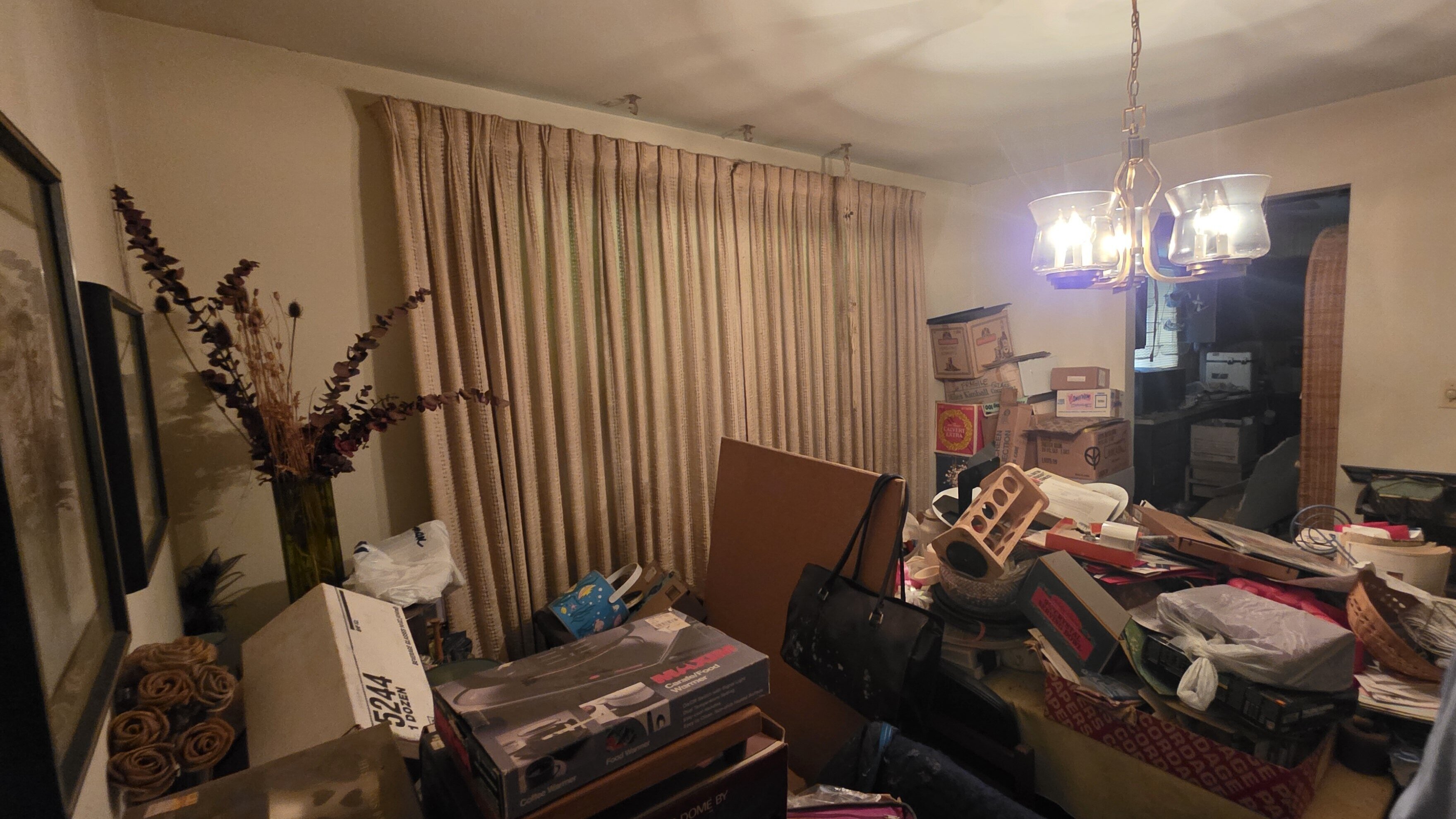 Living room full of belongings in an inherited house in Springfield, Ohio, sold as-is for cash